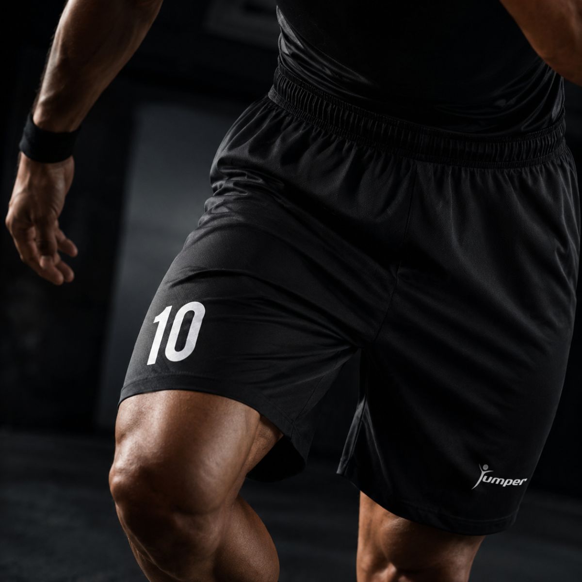 Close-up of a black athletic short with the number 10 on the left thigh and a Jumper logo.
